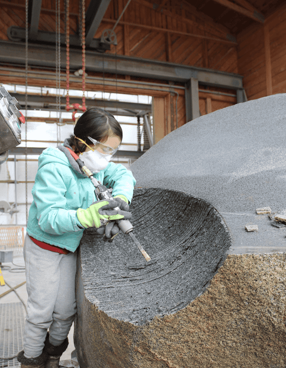 Stone grinding and polishing process at TEMPOart workshop.