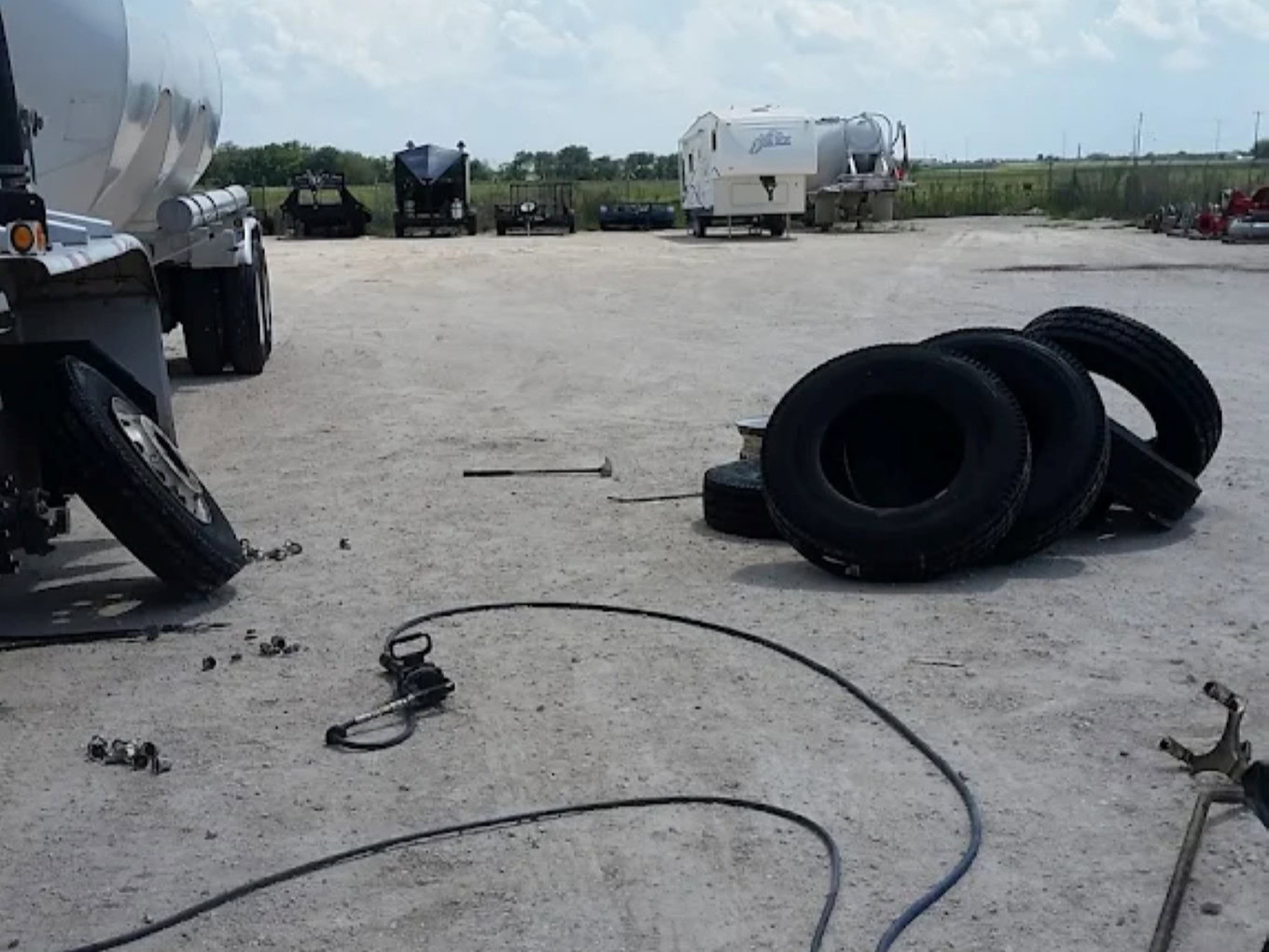 Stacked tires and tools at Texas Automotive & Tire LLC.