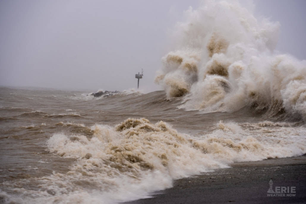 Wild stormy sea waves crashing during severe weather event.