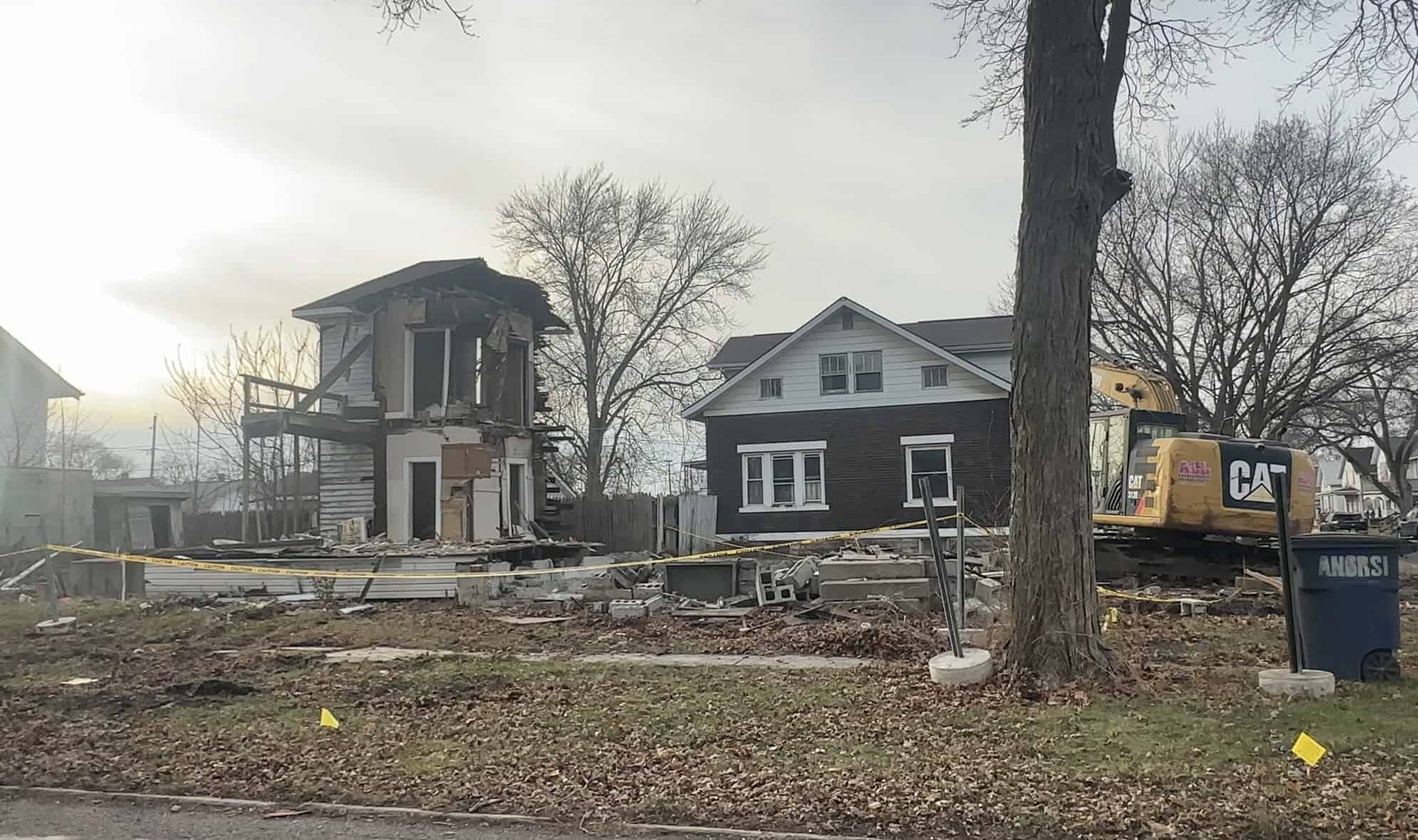 Construction equipment on site for house removal in Fostoria, Ohio.