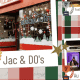 Colorful holiday window display with Christmas decor and festive lighting.