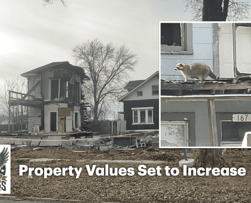 Damaged house after fire in Fostoria with a raccoon on the roof, property value increase news.