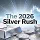 Silver coins and bars with stock chart background representing the 2026 Silver Rush trend.