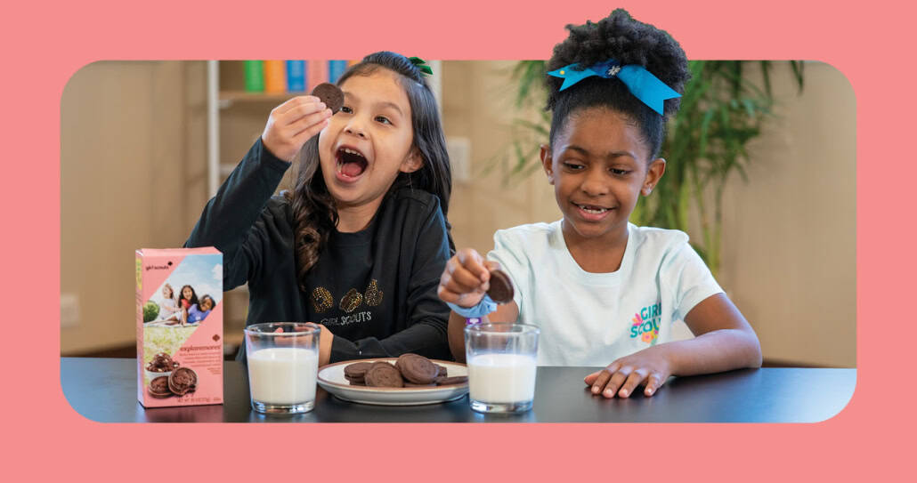 Kids enjoying chocolate cookies with milk, fun snack time, smiling children, Fostoria Free Press.