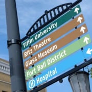 Tiffin University campus directions sign with local landmarks and points of interest.