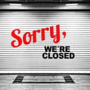 Closed business sign, storefront shutter, local news closure, Fostoria Free Press.