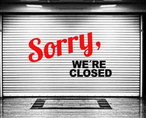 Closed business sign, storefront shutter, local news closure, Fostoria Free Press.