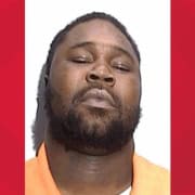 Man with a beard and closed eyes in a mugshot, criminal justice, law enforcement.