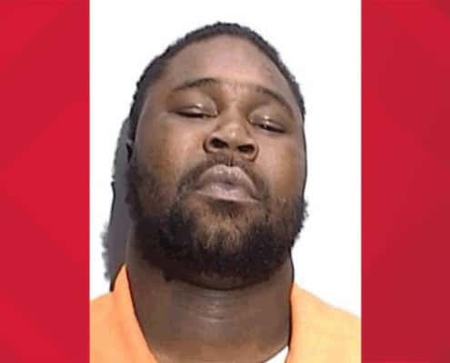 Man with a beard and closed eyes in a mugshot, criminal justice, law enforcement.