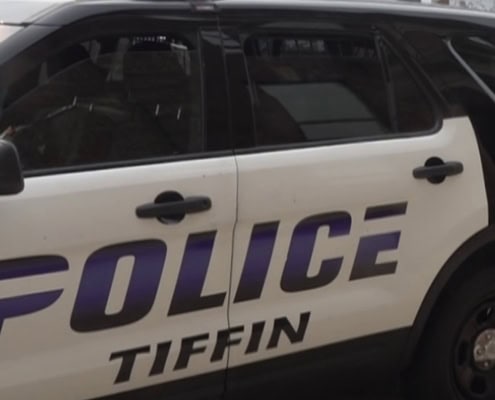 Police car in Tiffin, Ohio, with official markings and emergency lights, used for local law enforcement.
