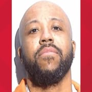 Man with a beard and serious expression, image from The Fostoria Free Press.
