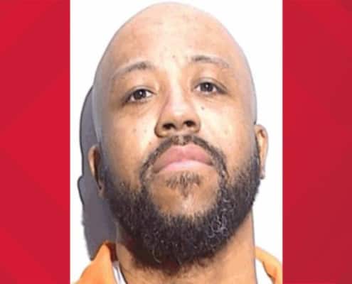 Man with a beard and serious expression, image from The Fostoria Free Press.