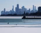 Fostoria skyline with city buildings and waterfront view at dusk, promoting local news and community.