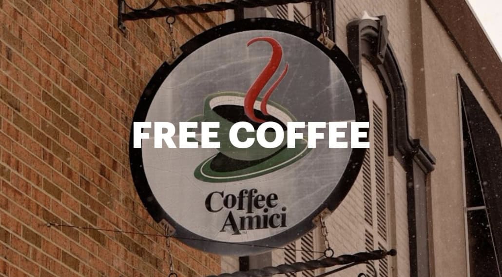 Fostoria News Coffee Amici sign offering free coffee to community members.