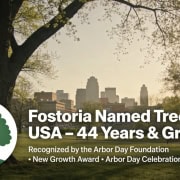 Fostoria News Fostoria named Tree City USA for 44 years with growth award, city skyline in background.
