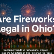 Fireworks display over a crowd in Ohio with colorful explosions in the sky.