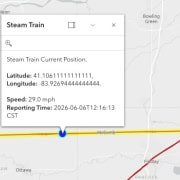 Fostoria News Steam train approaching McComb, Ohio, on the railway line.