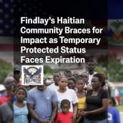 Fostoria News Haitian community gathering in Fostoria with American and Haitian flags in background.