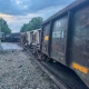 Derailed train cars on tracks after a train derailment incident.