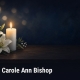 Illustration of a lit white candle and white lilies on a dark table, with text: Obituary: Carole Ann Bishop