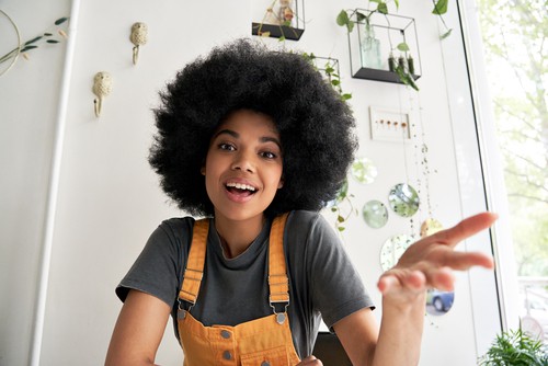 4C photo Woman with tightly packed 4C zig-zag coils showing significant shrinkage.