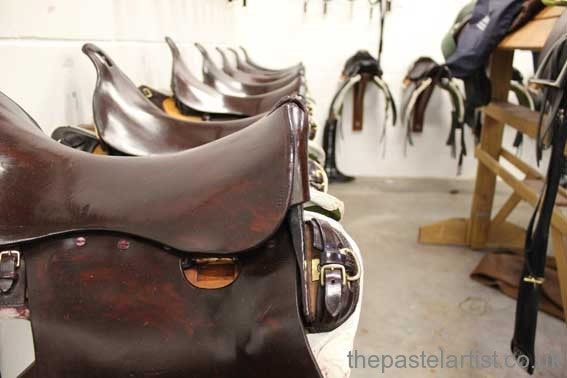 The King’s Troop Royal Horse Artillery - saddles in lines with highly polished leather.