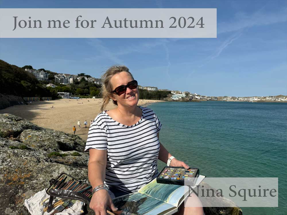 Nina Squire, painting siting on a rock
