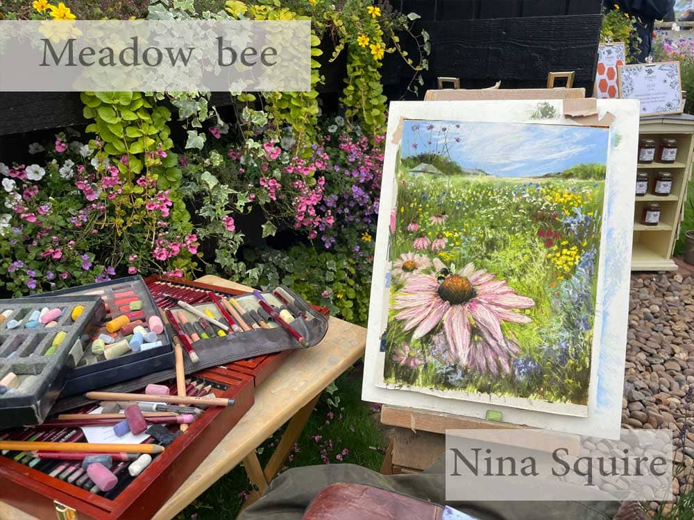 artwork by nina squire in soft pastel of a meadow and bee