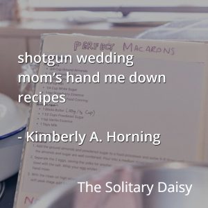An open recipe book with handwritten notes sits on a kitchen counter, partially covered by baking utensils and food, with overlaid text featuring a poem by Kimberly A. Horning.