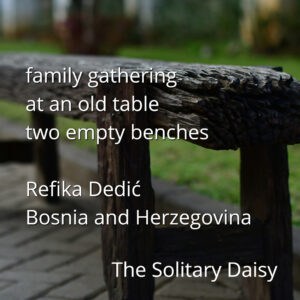 Two empty, weathered wooden benches at an outdoor table, with grass and blurred plants in the background. Text overlays include a poem and contributor names.