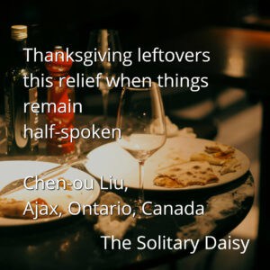 A dimly lit table with empty wine glasses, plates with leftover food, and a bottle, accompanied by a haiku and credit to Chen-ou Liu from The Solitary Daisy.