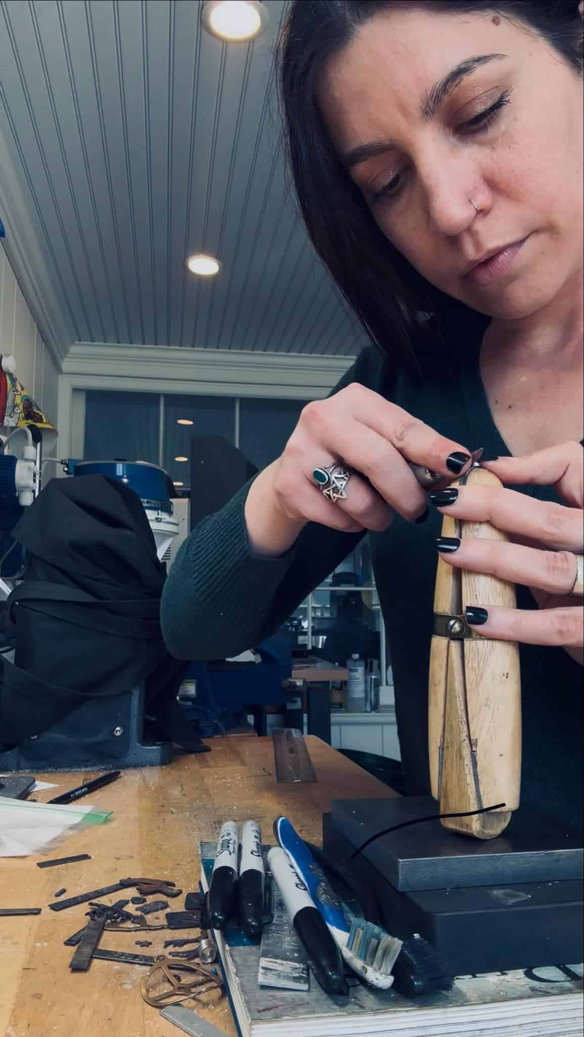 Jacqueline of The Wicked Griffin working in her jewelry studio