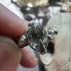 Faceted oval green amethyst held in sterling silver claws, US ring size 7.5