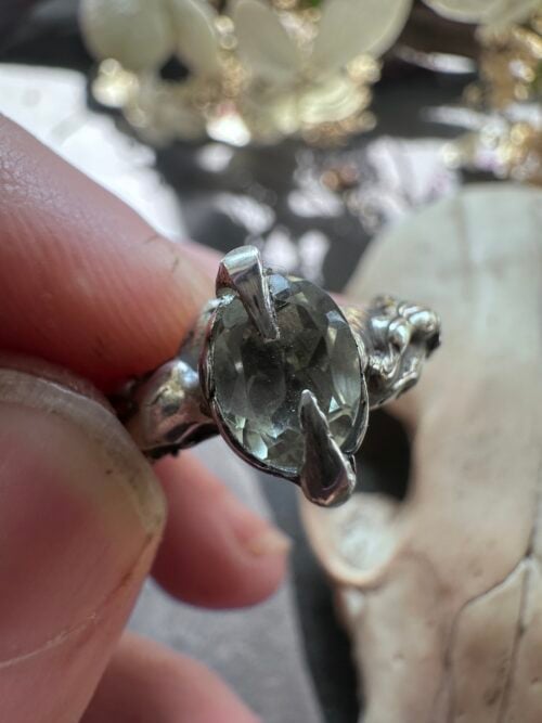 Faceted oval green amethyst held in sterling silver claws, US ring size 7.5 Faceted oval green amethyst held in sterling silver claws, US ring size 7.5