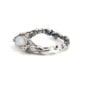Side view of the rainbow moonstone setting and organic sterling silver band