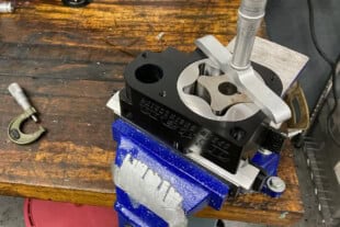 Titan Speed Engineering high-performance engine component undergoing precision assembly on a workbench.