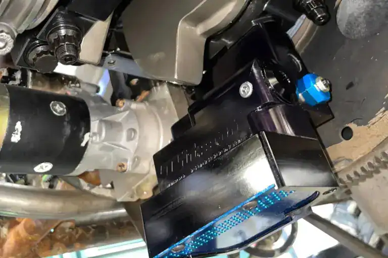 High-performance engine component installation in a racing car engine bay for optimized power and reliability.