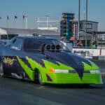 High-speed drag racing car at Titan Speed Engineering, showcasing advanced vehicle modifications and tuning for optimal performance on the racetrack.