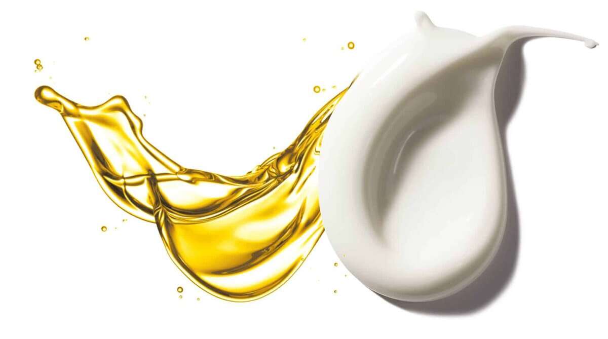 Dadi' Lotion 8fl oz with golden oil splash and white container.