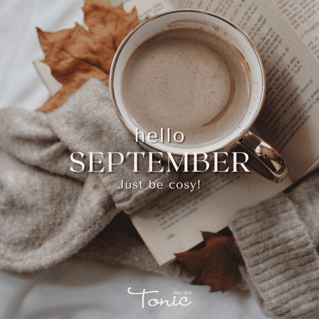 Cozy coffee cup with autumn leaves and newspaper, perfect for September relaxation.