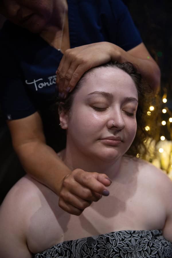 Photo of a client having a deeply relaxing Indian Head massage