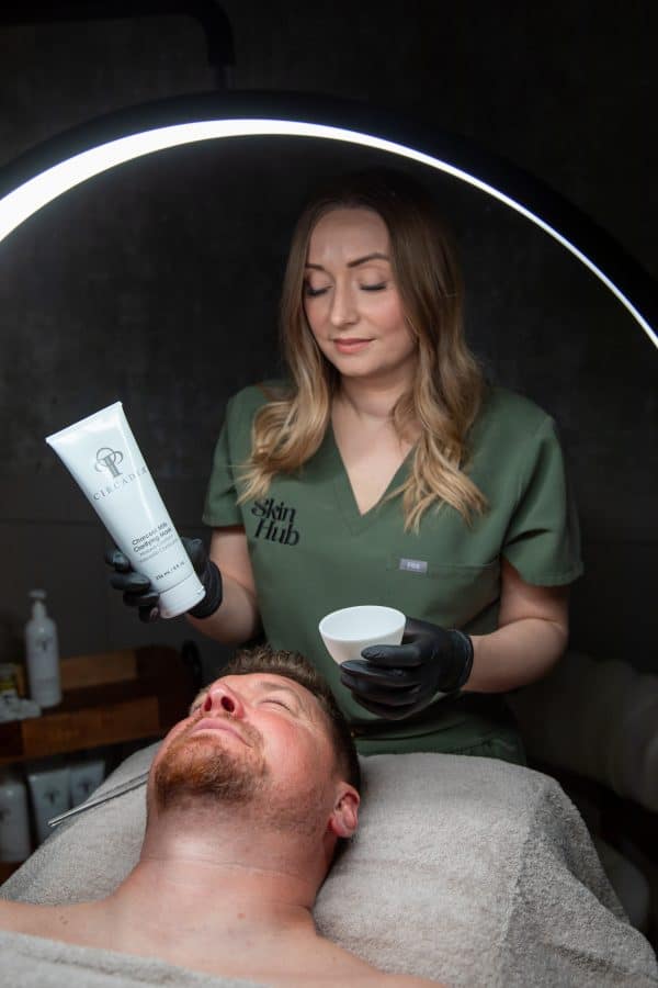 A photo of a Skin therapist preparing Circadia products before a facial