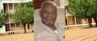Homme âgé souriant dans un cadre intérieur au Togo.