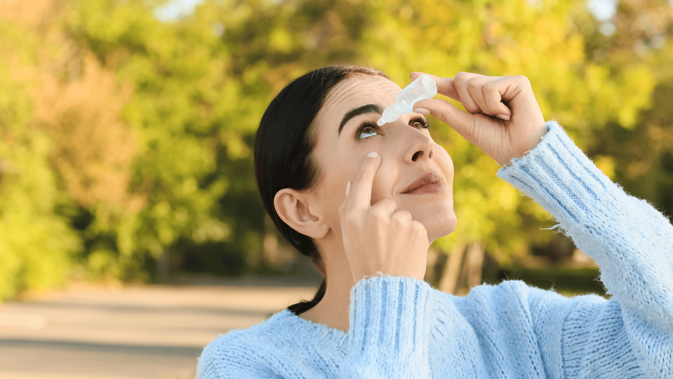Woman applying eye drops for dry eyes before a LASIK consultation in Billings, MT
