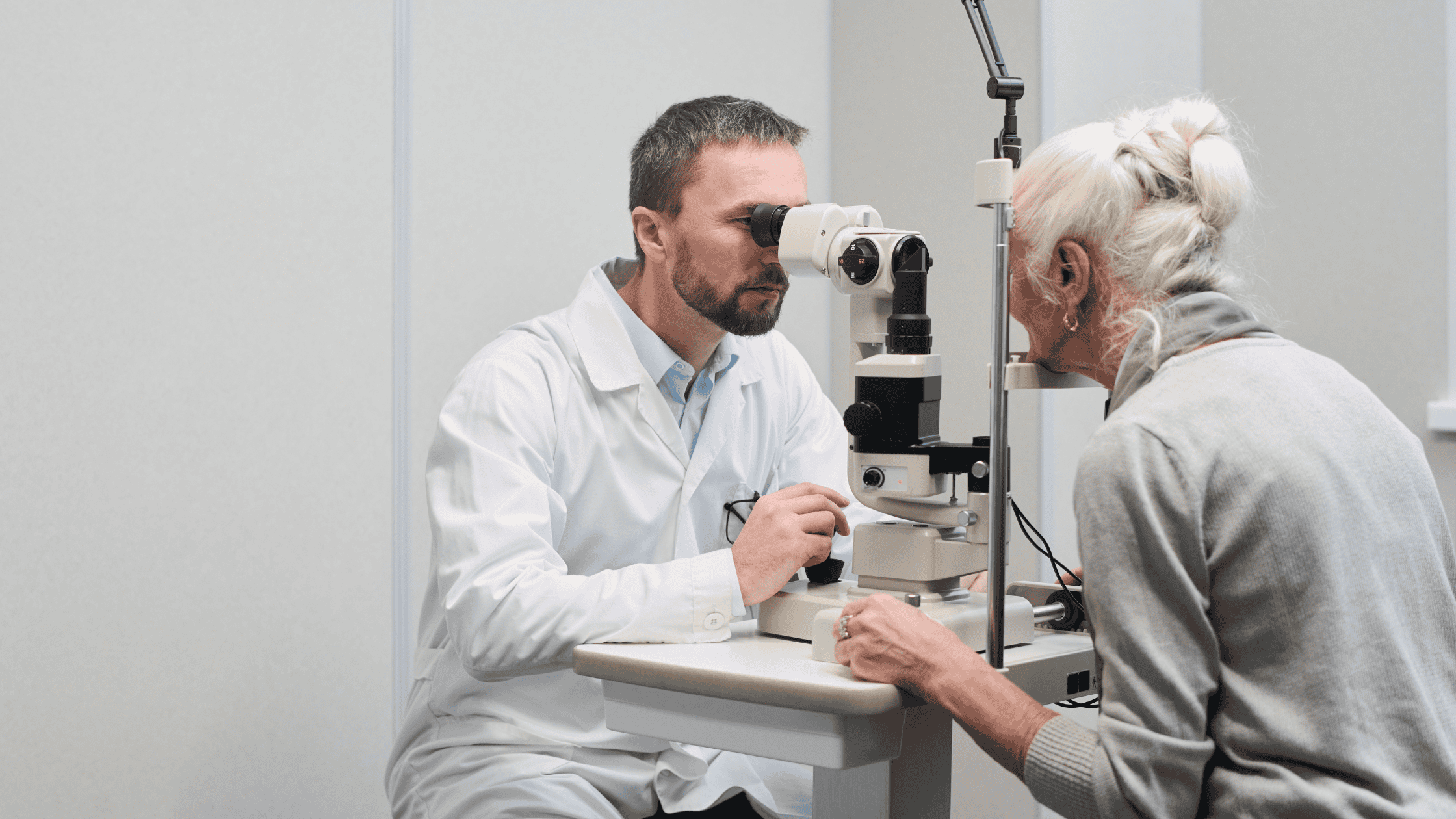 Eye doctor using a slit lamp to examine an older patient for prediabetes eye changes in Billings, MT