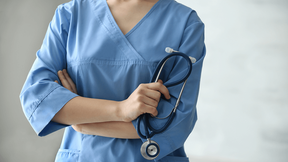 Bridget, a compassionate medical assistant, holding stethoscope in a clinic setting