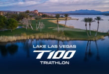 Serene lake view in Las Vegas with palm trees and a lush golf course, promoting the Lake Las Vegas T100 Triathlon event. Stunning landscape perfect for triathlon training and competition.