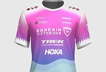 Bahrain Victorious professional cycling jersey featuring pink, purple, and blue gradient design with team logos and sponsors for triathlon and cycling events.