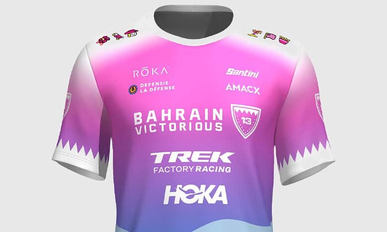 Bahrain Victorious professional cycling jersey featuring pink, purple, and blue gradient design with team logos and sponsors for triathlon and cycling events.