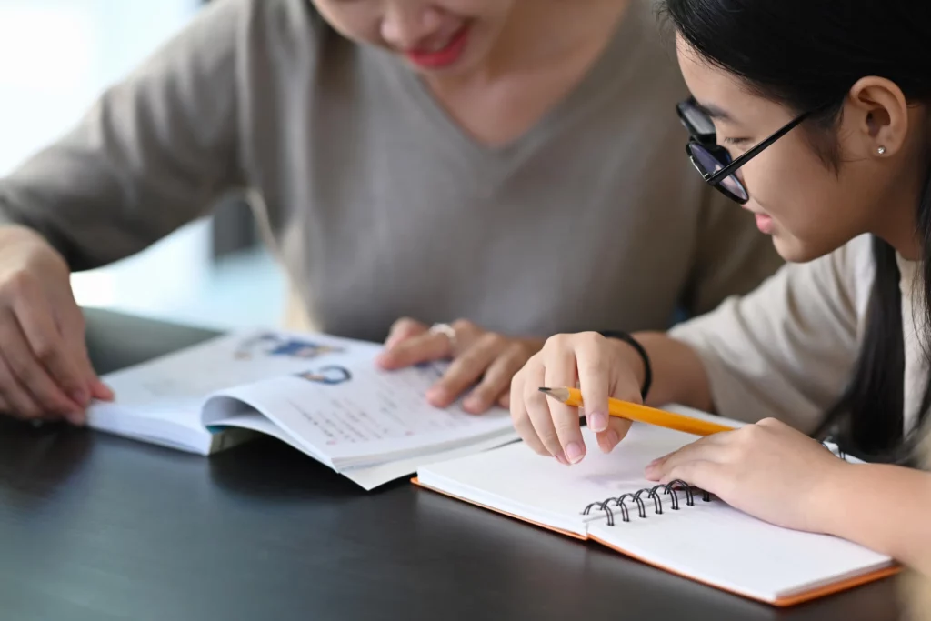 a close up of a teacher and student private tutor session